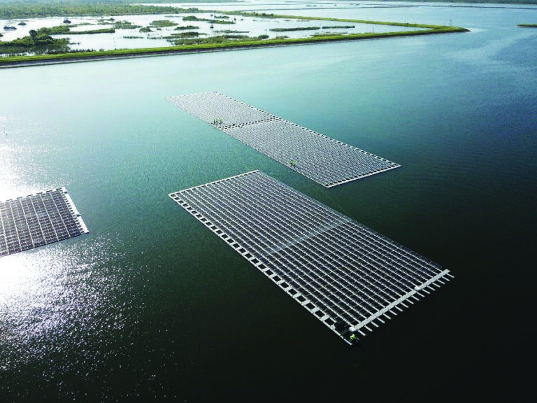 Floating solar panels creating energy, saving water